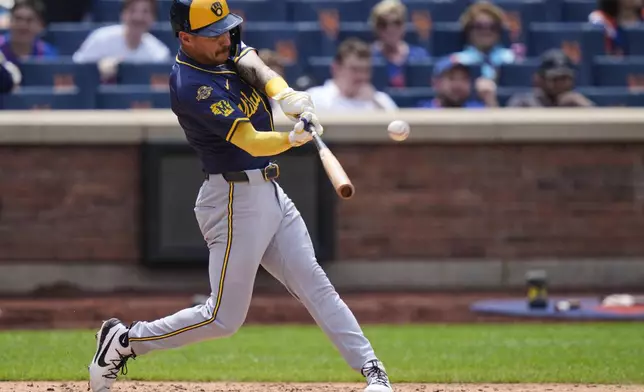 Milwaukee Brewers' Joey Ortiz hits a grand slam during the sixth inning in the first baseball game of a doubleheader against the New York Mets Wednesday, July 2, 2025, in New York. (AP Photo/Frank Franklin II)