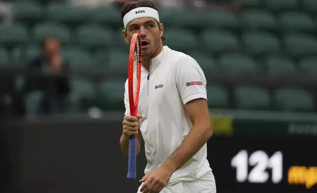 Taylor Fritz of the U.S. reacts during his men's singles fourth round match against Jordan Thompson of Australia at the Wimbledon Tennis Championships in London, Sunday, July 6, 2025.(AP Photo/Joanna Chan)