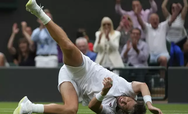 Cameron Norrie of Britain celebrates winning his men's singles fourth round match against Nicolas Jarry of Chile at the Wimbledon Tennis Championships in London, Sunday, July 6, 2025.(AP Photo/Joanna Chan)