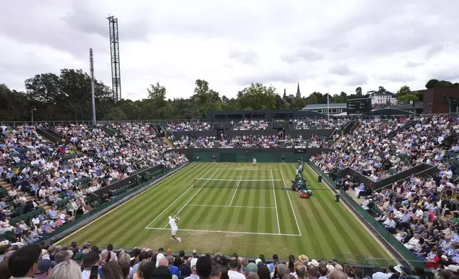 General view at Court two as Karen Khachanov of Russia plays a return to Kamil Majchrzak of Poland during their men's singles fourth round match at the Wimbledon Tennis Championships in London, Sunday, July 6, 2025.(AP Photo/Kirsty Wigglesworth)