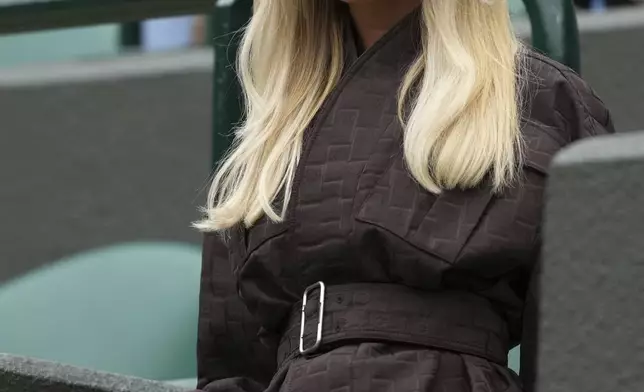 Taylor Fritz's girlfriend, Morgan Riddle, arrives to watch Taylor Fritz of the U.S. playing Jordan Thompson of Australia for the men's singles fourth round match at the Wimbledon Tennis Championships in London, Sunday, July 6, 2025.(AP Photo/Joanna Chan)