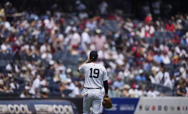New York Yankees third baseman Ryan McMahon (19) enters the field during the first inning of a baseball game against the Philadelphia Phillies, Saturday, July 26, 2025, in New York. (AP Photo/Yuki Iwamura)
