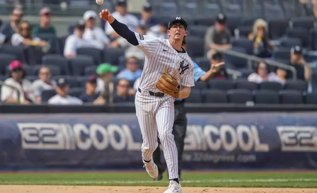 New York Yankees third baseman Ryan McMahon (19) throws out Philadelphia Phillies' Otto Kemp at first base during the eighth inning of a baseball game, Saturday, July 26, 2025, in New York. (AP Photo/Yuki Iwamura)