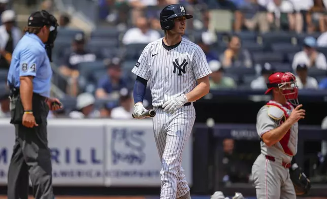 New York Yankees' Ryan McMahon (19) walks away after striking out during the second inning of a baseball game against the Philadelphia Phillies, Saturday, July 26, 2025, in New York. (AP Photo/Yuki Iwamura)