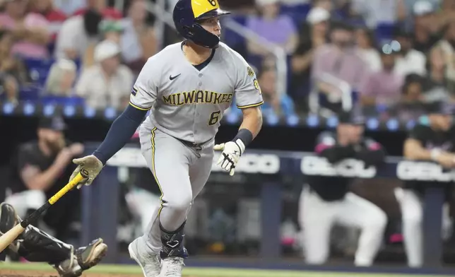 Milwaukee Brewers' Isaac Collins (6) runs after hitting a RBI single to score Jackson Chourio during the fourth inning of a baseball game against the Miami Marlins, Saturday, July 5, 2025, in Miami. (AP Photo/Lynne Sladky)