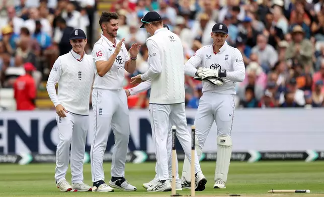 England's Josh Tongue celebrates with his teammamtes after bowling out India's KL Rahul during day four of the second cricket test match between England and India at Edgbaston in Birmingham, England, Saturday, July 5, 2025. (AP Photo/Scott Heppell)