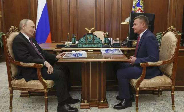 FILE - Russian President Vladimir Putin, left, meets with Russian Transport Minister Roman Starovoyt at the Kremlin in Moscow, Russia, Thursday, Jan. 30, 2025. (Gavriil Grigorov, Sputnik, Kremlin Pool Photo via AP, File)