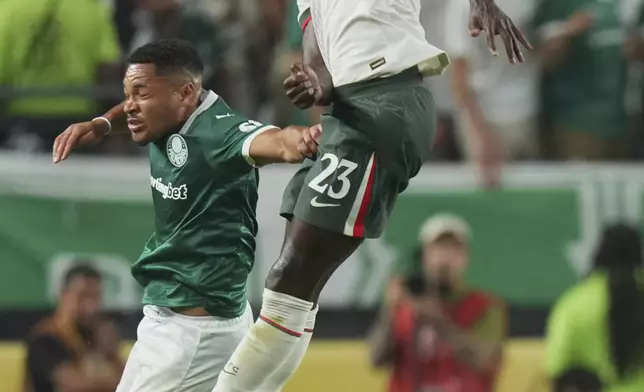Chelsea's Trevoh Chalobah, top, heads a ball next to Palmeiras' Vitor Roque, bottom, during the Club World Cup quarterfinal soccer match between Palmeiras and Chelsea in Philadelphia, Friday, July 4, 2025. (AP Photo/Chris Szagola)