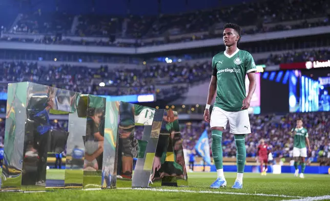 Palmeiras' Estevao walks on the pitch before the Club World Cup quarterfinal soccer match between Palmeiras and Chelsea in Philadelphia, Friday, July 4, 2025. (AP Photo/Derik Hamilton)