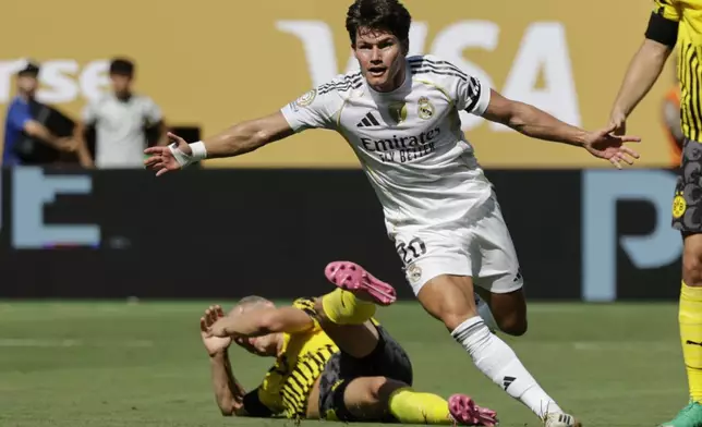 Real Madrid's Fran Garcia celebrates after scoring his side's second goal against Borussia Dortmund during the Club World Cup quarterfinal soccer match between Real Madrid and Borussia Dortmund in East Rutherford, N.J., Saturday, July 5, 2025. (AP Photo/Adam Hunger)
