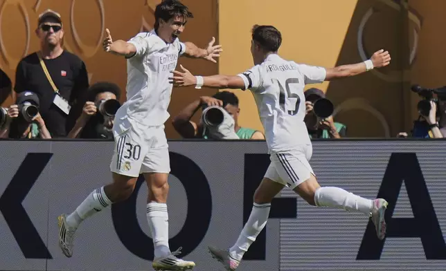 Real Madrid's Gonzalo Garcia, left, and Arda Guler celebrate after Garcia scored a goal against Borussia Dortmund during the first half of a Club World Cup quarterfinal soccer match, Saturday, July 5, 2025 in East Rutherford, N.J. (AP Photo/Frank Franklin II)