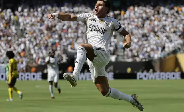 Real Madrid's Fran Garcia celebrates after scoring his side's second goal against Borussia Dortmund during the Club World Cup quarterfinal soccer match between Real Madrid and Borussia Dortmund in East Rutherford, N.J., Saturday, July 5, 2025. (AP Photo/Adam Hunger)