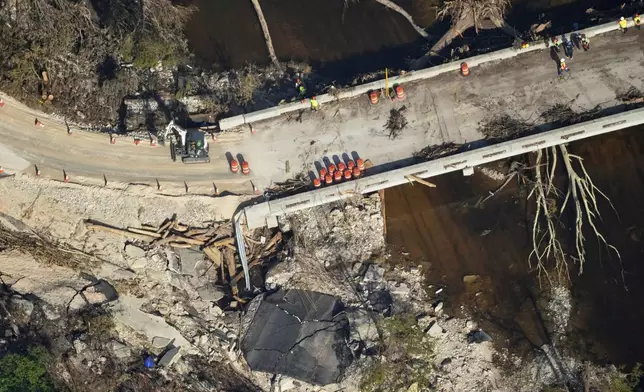 This aerial photo shows damage from flash floods along the Guadalupe River in Ingram, Texas, Thursday, July 10, 2025. (AP Photo/Gerald Herbert)