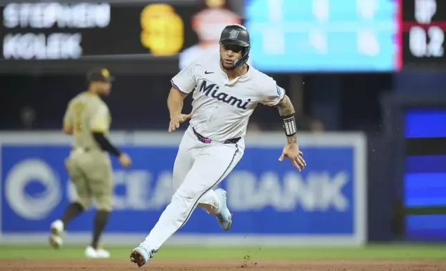 Miami Marlins' Agustín Ramírez runs the bases on his way to scoring on a hit by Kyle Stowers in the first inning of a baseball game against the San Diego Padres, Tuesday, July 22, 2025, in Miami. (AP Photo/Rebecca Blackwell)