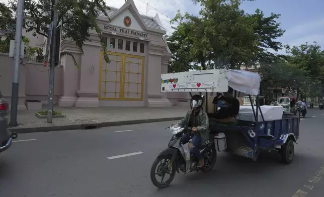 A local motorcar drives past the Thai Embassy in Phnom Penh, Cambodia, Thursday, July 24, 2025. (AP Photo/Heng Sinith)