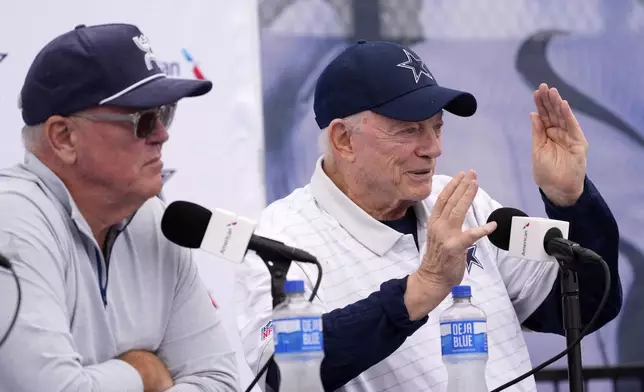 Jerry Jones, right, Dallas Cowboys owner, president, and general manager speaks to reporters as Stephen Jones, Cowboys co-owner, executive vice president, CEO, and director of player personnel listen during a news conference to open training camp Monday, July 21, 2025, in Oxnard, Calif. (AP Photo/Mark J. Terrill)
