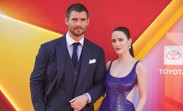 CORRECTS ORDER OF PEOPLE - David Corenswet , left, and Rachel Brosnahan arrive at the premiere of "Superman" on Monday, July 7, 2025, at TCL Chinese Theatre in Los Angeles. (Photo by Jordan Strauss/Invision/AP)