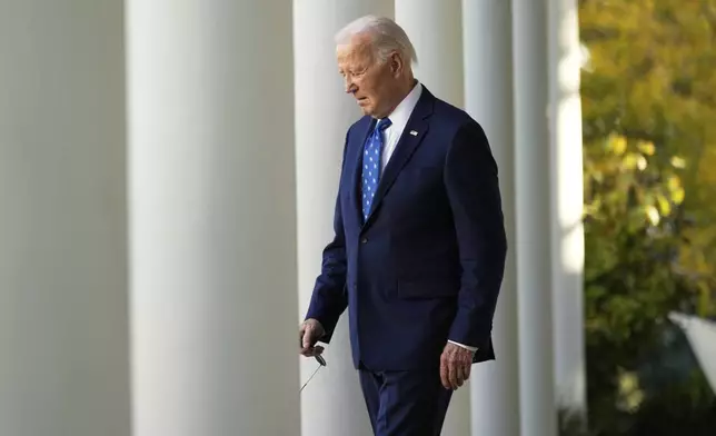 FILE - President Joe Biden walks out to speak in the Rose Garden of the White House in Washington, Nov. 26, 2024. (AP Photo/Ben Curtis, File)