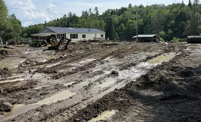 Damage from flash floods is shown at the home of Michelle Tanner, Friday, July 11, 2025 in Sutton, Vt. (AP Photo/Amanda Swinhart)