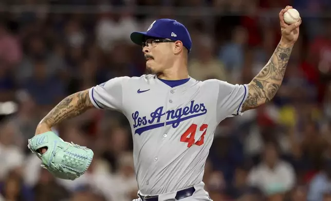 Los Angeles Dodgers pitcher Anthony Banda throws during the sixth inning of a baseball game against the Boston Red Sox, Friday, July 25, 2025, in Boston. (AP Photo/Mark Stockwell)
