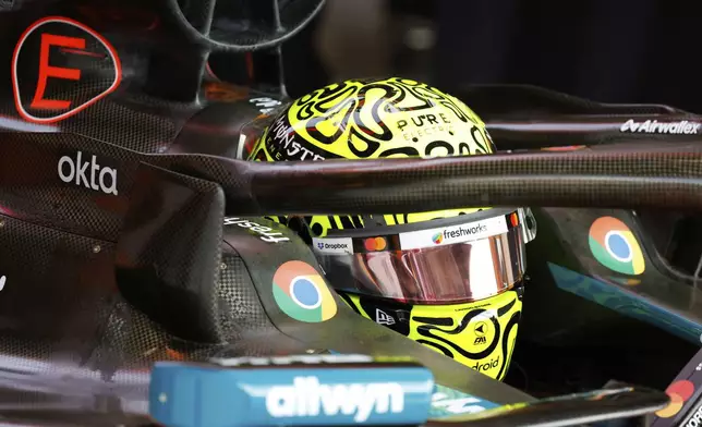 McLaren driver Lando Norris of Britain sits in his car during the first practice session ahead of the Formula One Grand Prix at the Spa-Francorchamps racetrack in Spa, Belgium, Friday, July 25, 2025. (AP Photo/Geert Vanden Wijngaert)