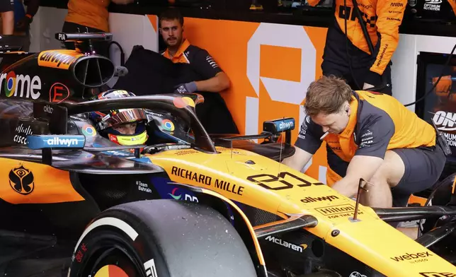 McLaren driver Oscar Piastri of Australia sits in his car during the first practice session ahead of the Formula One Grand Prix at the Spa-Francorchamps racetrack in Spa, Belgium, Friday, July 25, 2025. (AP Photo/Geert Vanden Wijngaert)