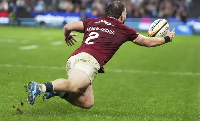 Luke Cowan-Dickie of the British &amp; Irish Lions reaches out to catch the ball during the Lions and Waratahs rugby match in Sydney, Australia, Saturday, July 5, 2025. (AP Photo/Mark Baker)