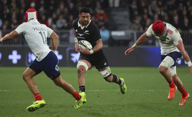 New Zealand's Ardie Savea runs at the defence during their rugby test against France in Dunedin, New Zealand, Saturday, July 5, 2025. (Marty Melville/Photosport via AP)