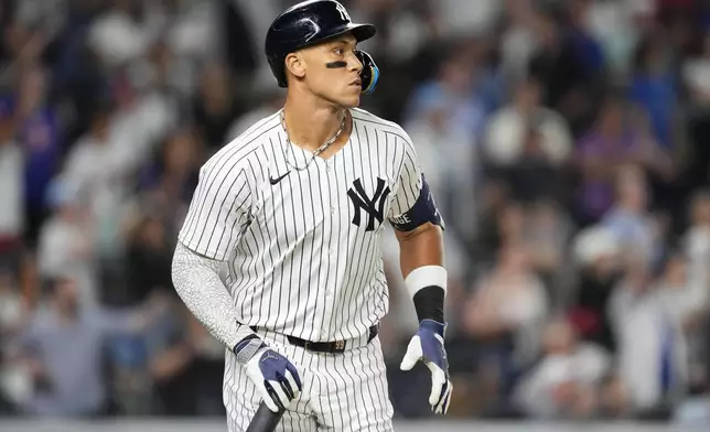 New York Yankees designated hitter Aaron Judge runs after hitting a sacrifice fly during the 10th inning of a baseball game against the Seattle Mariners, Thursday, July 10, 2025, in New York. (AP Photo/Yuki Iwamura)