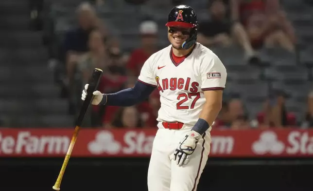 Los Angeles Angels' Mike Trout smiles after taking a pitch from Texas Rangers position player Ezequiel Duran during the ninth inning of a baseball game Tuesday, July 8, 2025 in Anaheim, Calif. (AP Photo/Mark J. Terrill)