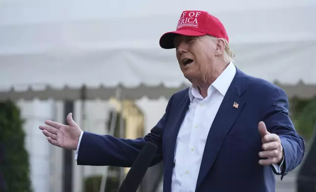 President Donald Trump speaks to the media before walking across the South Lawn of the White House to board Marine One en route to Joint Base Andrews, Md., and on to Florida, Tuesday, July 1, 2025, in Washington. (AP Photo/Mark Schiefelbein)