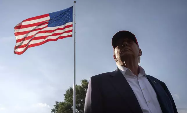 President Donald Trump speaks to the media before walking across the South Lawn of the White House to board Marine One en route to Joint Base Andrews, Md., and on to Florida, Tuesday, July 1, 2025, in Washington. (AP Photo/Mark Schiefelbein)