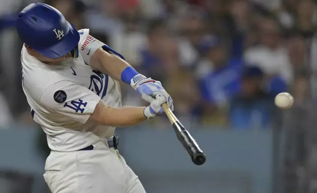 Los Angeles Dodgers' Will Smith hits his second solo home run of the game during the sixth inning of a baseball game against the Minnesota Twins, Monday, July 21, 2025, in Los Angeles. (AP Photo/Jayne Kamin-Oncea)