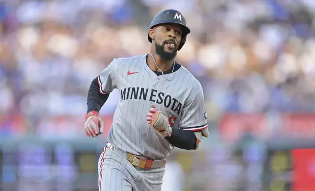 Minnesota Twins' Byron Buxton circles the bases after hitting a home run off of Los Angeles Dodgers pitcher Shohei Ohtani during the first inning of a baseball game in Los Angeles, Monday, July 21, 2025. (AP Photo/Jayne Kamin-Oncea)
