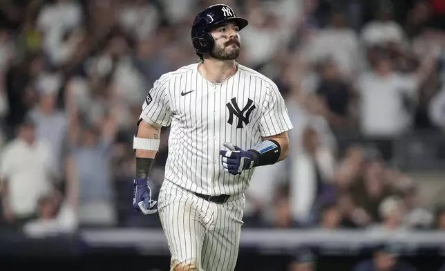 New York Yankees' Austin Wells (28) hits a home run during the sixth inning of a baseball game against the Seattle Mariners, Tuesday, July 8, 2025, in New York. (AP Photo/Yuki Iwamura)
