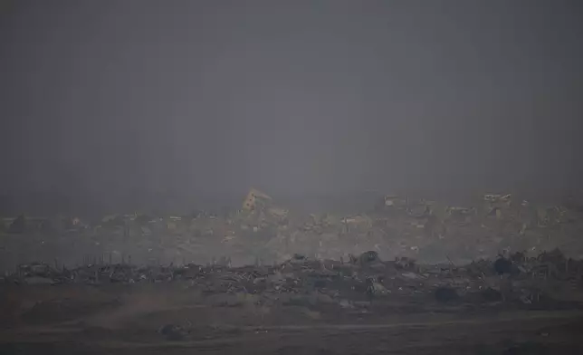 Destroyed buildings in the Gaza Strip are seen from a southern Israel location on Sunday, July 13, 2025. (AP Photo/Ohad Zwigenberg)