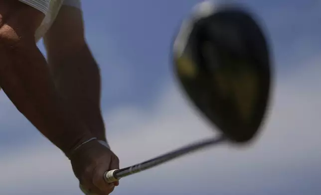 Rory McIlroy of Northern Ireland grips the driver as he hits his tee shot on the 7th tee during a practice round for the British Open golf championship at the Royal Portrush Golf Club, Northern Ireland, Wednesday, July 16, 2025. (AP Photo/Francisco Seco)