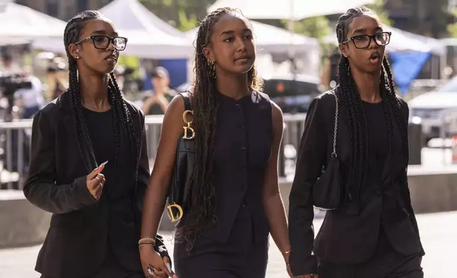 Lila Combs, Chance Combs and Jessie Combs, daughters of Sean Combs, arrive at court on Monday, June 30, 2025, in New York. (AP Photo/Yuki Iwamura)