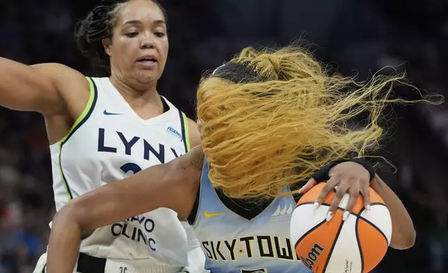 Chicago Sky forward Angel Reese, right, works toward the basket as Minnesota Lynx forward Napheesa Collier defends during the second half of a WNBA basketball game Tuesday, July 22, 2025, in Minneapolis. (AP Photo/Abbie Parr)