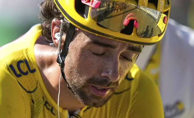 Ireland's Ben Healy crosses the finish line after losing his overall leader's yellow jersey in the twelfth stage of the Tour de France cycling race over 180.6 kilometers (112.2 miles) with start in Auch and finish in Hautacam, France, Thursday, July 17, 2025. (AP Photo/Mosa'ab Elshamy)