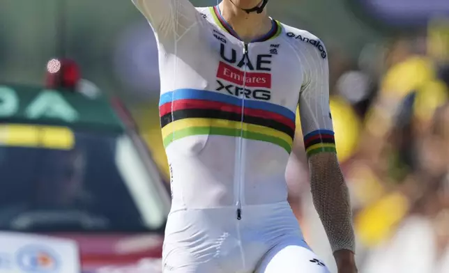 Slovenia's Tadej Pogacar crosses the finish line to win the twelfth stage of the Tour de France cycling race over 180.6 kilometers (112.2 miles) with start in Auch and finish in Hautacam, France, Thursday, July 17, 2025. (AP Photo/Mosa'ab Elshamy)