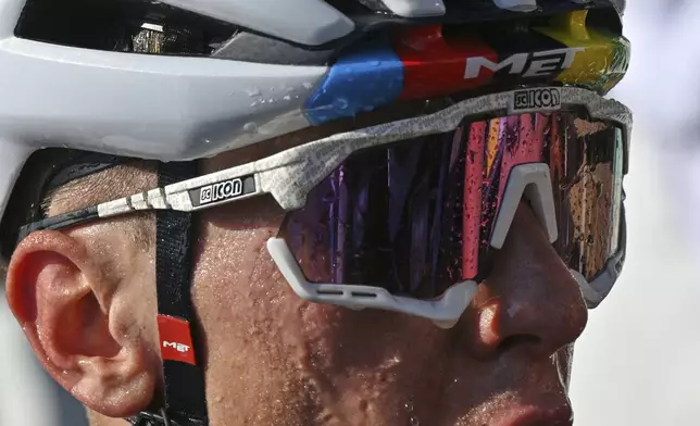 Stage winner Slovenia's Tadej Pogacar catches his breath after the twelfth stage of the Tour de France cycling race over 180.6 kilometers (112.2 miles) with start in Auch and finish in Hautacam, France, Thursday, July 17, 2025. (Dario Belingheri/Pool Photo via AP)