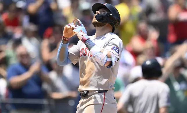 Boston Red Sox's Trevor Story celebrates his two-run home run during the eighth inning of a baseball game against the Washington Nationals, Friday, July 4, 2025, in Washington. (AP Photo/Nick Wass)