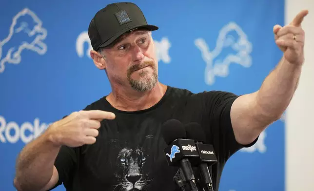 Detroit Lions head coach Dan Campbell gestures during a news conference before Back Together Weekend at NFL football training camp Saturday, July 26, 2025, in Allen Park, Mich. (AP Photo/Ryan Sun)