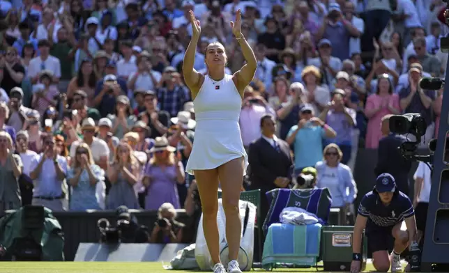 Aryana Sabalenka of Belarus celebrates after beating Laura Siegemund of Germany to win a quarterfinal women's singles match at the Wimbledon Tennis Championships in London, Tuesday, July 8, 2025. (AP Photo/Kirsty Wigglesworth)