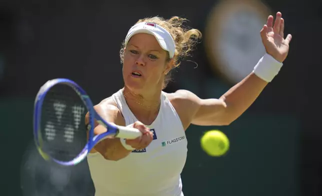 Laura Siegemund of Germany returns to Aryna Sabalenka of Belarus during a quarterfinal women's singles match at the Wimbledon Tennis Championships in London, Tuesday, July 8, 2025. (AP Photo/Kirsty Wigglesworth)