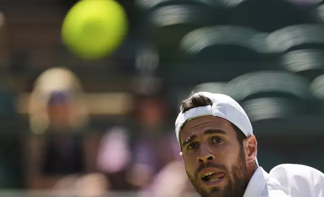 Karen Khachanov of Russia watches the ball during the men's singles quarter final match against Taylor Fritz of the U.S. at the Wimbledon Tennis Championships in London, Tuesday, July 8, 2025.(AP Photo/Kin Cheung)