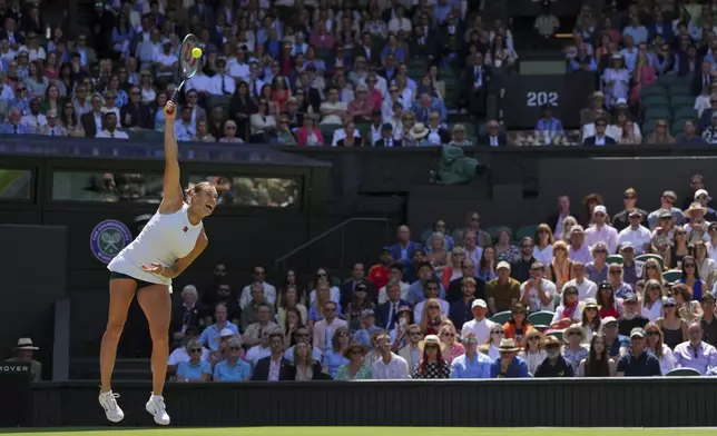 Aryana Sabalenka of Belarus serves to Laura Siegemund of Germany during a quarterfinal women's singles match at the Wimbledon Tennis Championships in London, Tuesday, July 8, 2025. (AP Photo/Kirsty Wigglesworth)