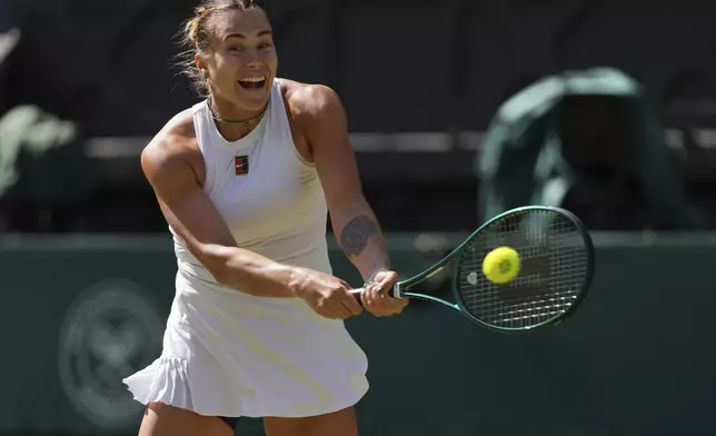 Aryana Sabalenka of Belarus returns to Laura Siegemund of Germany in a quarterfinal women's singles match at the Wimbledon Tennis Championships in London, Tuesday, July 8, 2025. (AP Photo/Kirsty Wigglesworth)