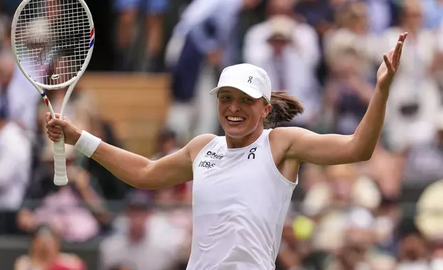 Iga Swiatek of Poland celebrates winning the women's singles quarter final match against Liudmilla Samsonova of Russia at the Wimbledon Tennis Championships in London, Wednesday, July 9, 2025.(AP Photo/Kirsty Wigglesworth)